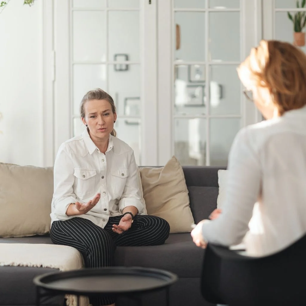 a woman receiving counseling in person