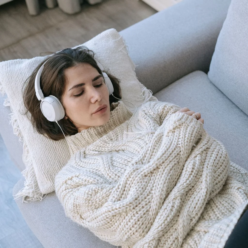 a woman wearing a headset which makes bilateral noises related to EMDR