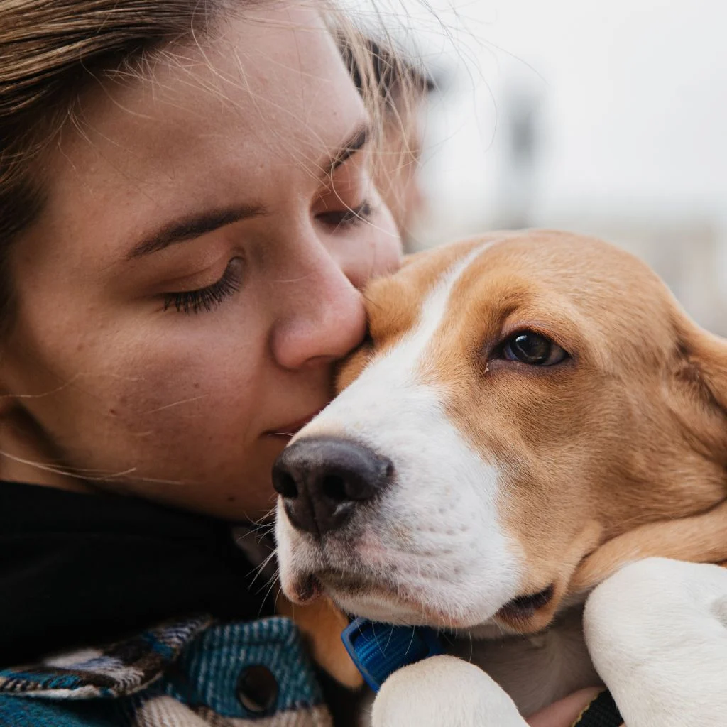 A woman with her Emotional Support Animal (ESA).