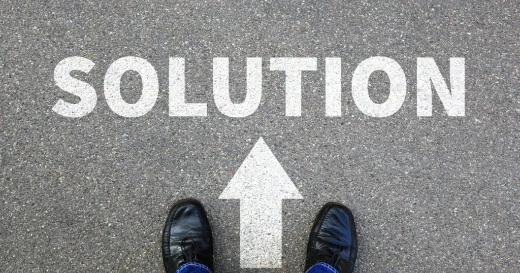 Feet of a person following the path to a solution.