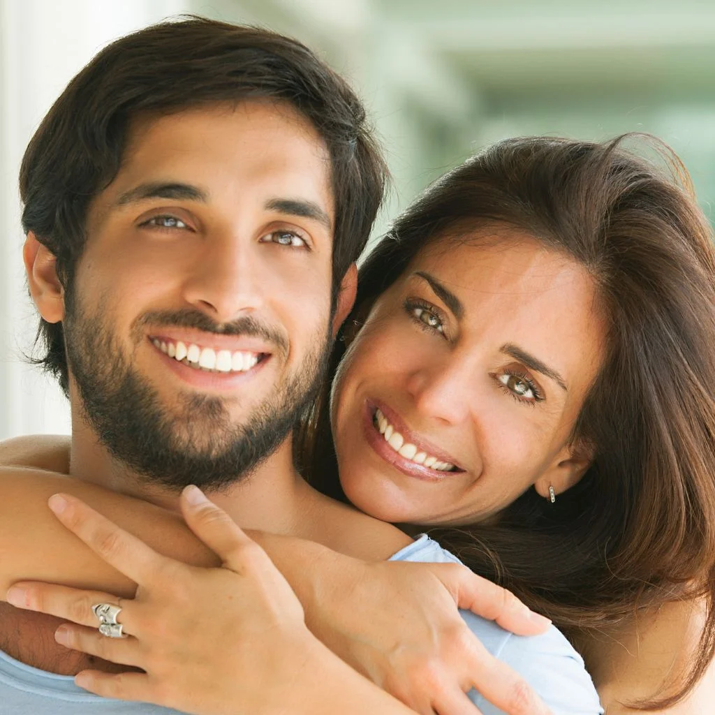Smiling Man Embraced By His Partner