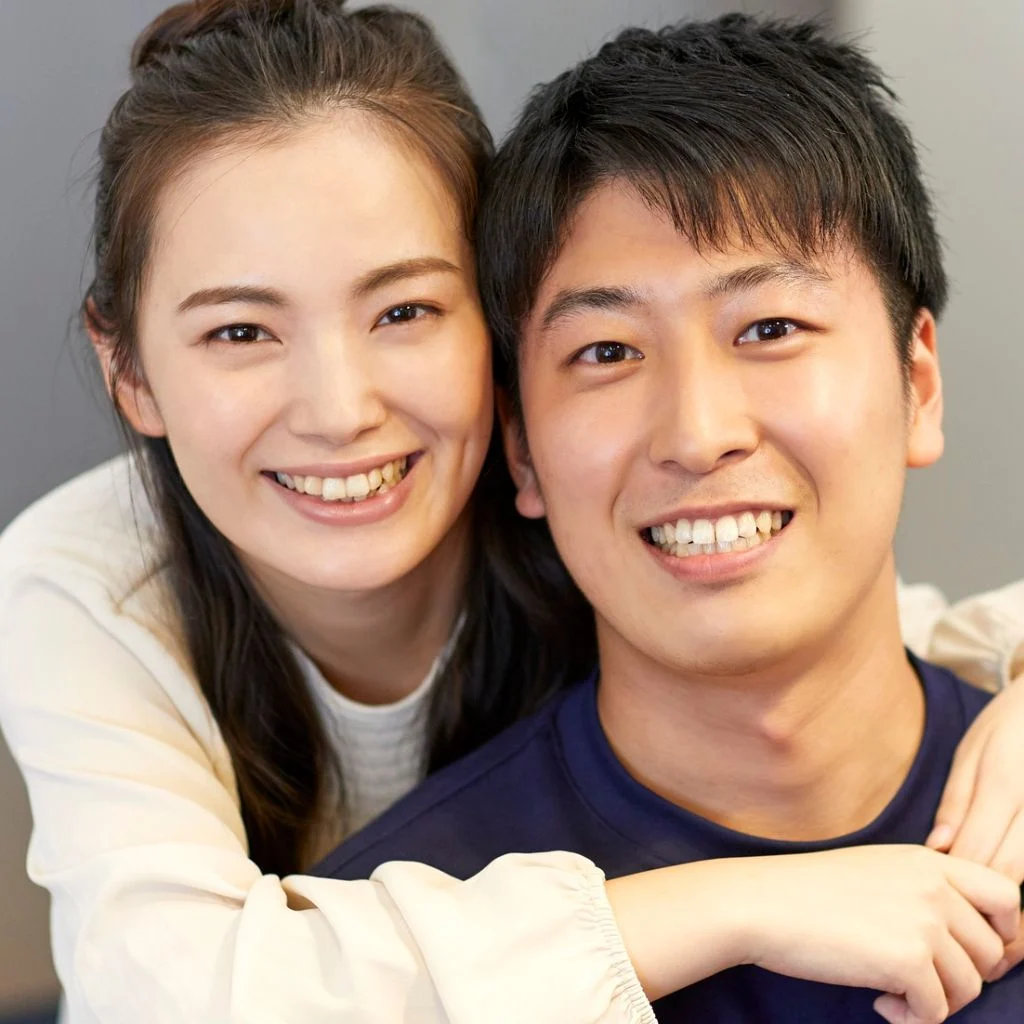 Smiling Couple Who Have Benefit From Counseling