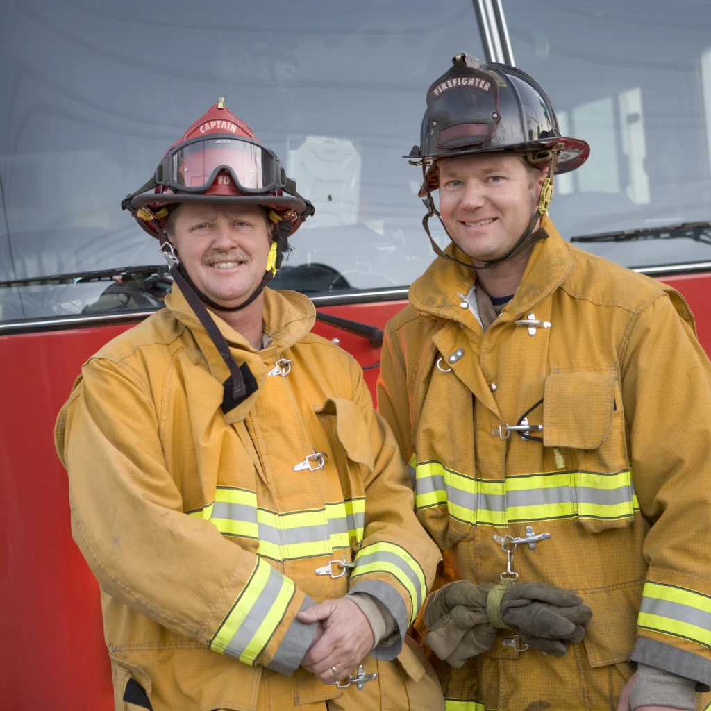 Firefighters in front of firetruck